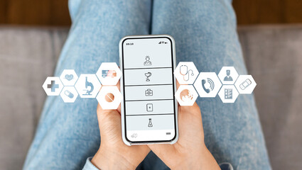 Woman at home using medical app on smartphone to access healthcare services