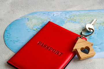 World map with passport and keys - booking hotel ot rental house concept