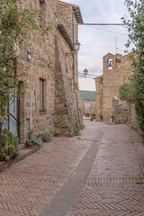 tile paved street and old tuff houses at medieval village, Sovana, Italy