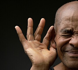 deafness suffering from hearing loss on grey black background with people stock image stock photo	