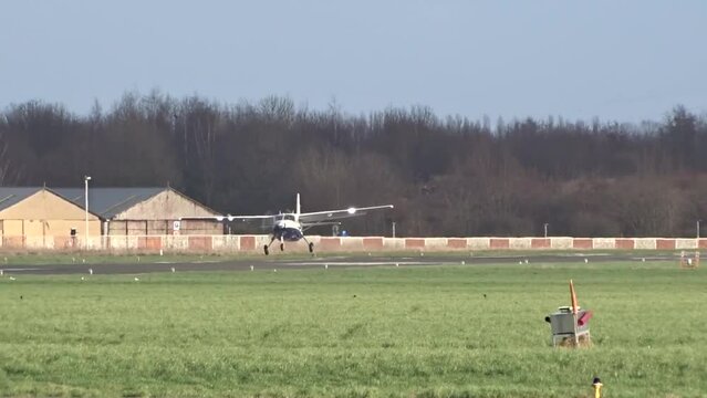 Regional Airplane Landing Arriving Arrival Touchdown at a Regional Small Local Airport Airfield