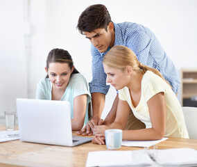 Teamwork, laptop or designers planning in meeting for news, documents or paperwork together in office. Collaboration, employees or people with research on online blog website for editing project