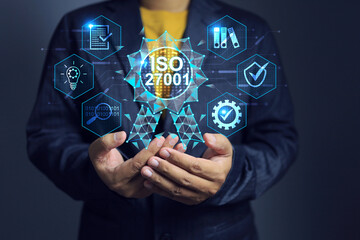 ISO 27001 concept of information security cybersecurity and privacy protection management systems requirements with businessman holding certificate represent to get a certified international standards