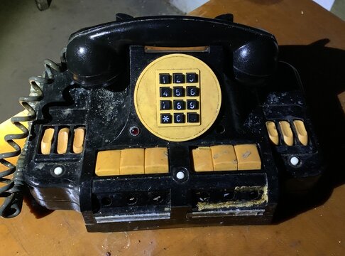 Retro style telephone set. Vintage black colored telephone on the table