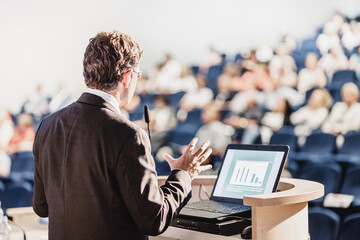 Speaker at Business Conference with Public Presentations. Audience at the conference hall....