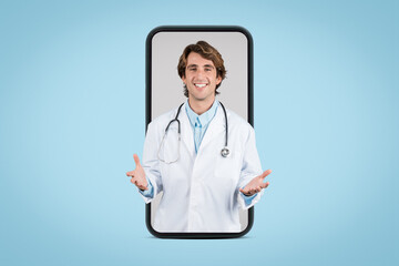 Friendly male doctor in white medical coat having online appointment with patient, posing in huge smartphone screen