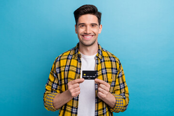 Portrait of good mood handsome guy with stubble wear checkered shirt fingers demonstrate credit...