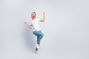 Fototapeta na wymiar Full length photo of eccentric girl with bob hair dressed white t-shirt win bet clenching fists scream isolated on gray color background