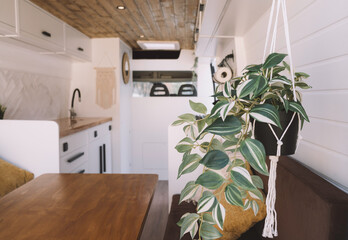 
Camper van interior made of wood in a traditional way and Nordic style.
Interior of a cozy...