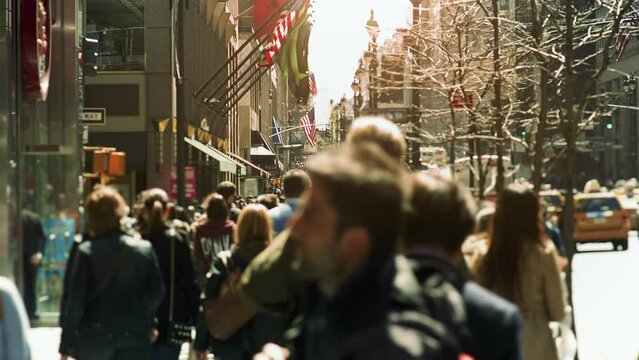 Large Crowd of People Walking in Big City Street. Anonymous Crowd. Daytime. Manhattan Busy Street. Traffic Passing By.
