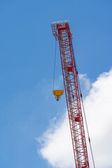 crane steel hook with cable on blue sky,Industrial equipment or tools.