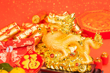 Tradition Chinese golden dragon statue,word on dragon Translation: good bless for year of the dragon,leafside word on paper board and coin Translation:good luck for new year.
