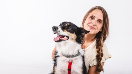 Portrait of a woman with a border collie dog with copy space