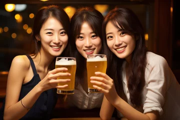 Fotobehang Korean Young Girls Share Smiles and Toast with Beers, Celebrating Friendship and Happiness. © pkproject