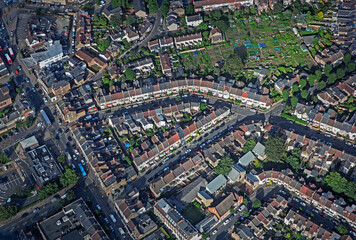 Aerial view of terraced housing in East London with allotment. 
