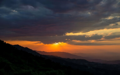 Fototapeta premium Sunset in the mountains cloudy sky