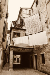 Linen is hanged to dry. Everyday life in Venice, Italy.  Sepia historic photo.