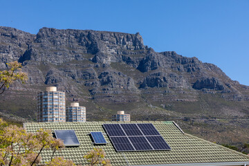 Solar panels, aimed at mitigating 'load-shedding' or blackouts, are seen on a residential roof in a suburb of Cape Town, South Africa.