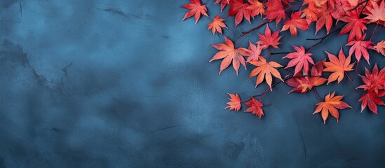 Autumn Background With Colored red leaves on blue