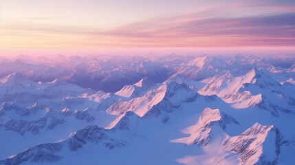 Aerial View from Airplane of Blue Snow Covered Canadian Mountain Landscape in Winter. Colorful Pink...