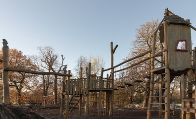 The Children's playground with Slide, Rope Net Bridge made of Wooden Tree trunk in acton park....