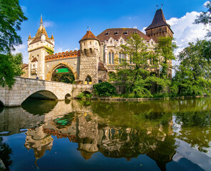 Amazing view of Vajdahunyad Castle reflected in the water in main City Park, Budapest, Hungary