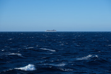 Huge modern cruiseship or cruise ship liner Magnific at sea in summer during Mediterranean cruising...