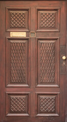 Vintage wooden brown door close-up - 692623504