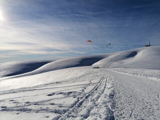 Naklejka na ściany i meble Flying over the snowy mountain