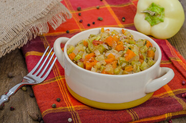 Bowl with vegetable stew on a checkered towel