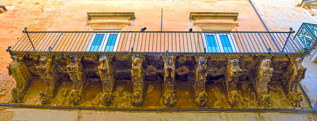 Obraz premium details of ancient buildings in baroque style in the historic center of Lecce Italy