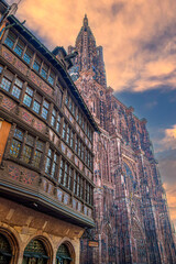 View from Place de la Cathédrale of the medieval Maison Kammerzell, and exterior of Notre Dame Cathedral de Strasbourg, France - 692636750