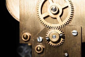 Vintage clock mechanism close up photo with selective focus. Gears