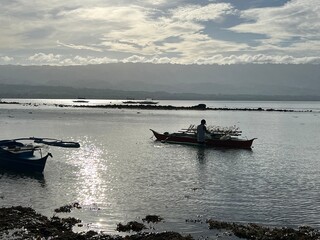 Fisherman working in a low tide time in Philippines. High quality photo