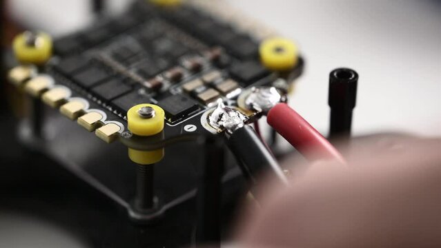 Process Of Soldering Power Wires To Microchip Of Fpv Drone