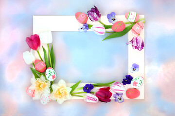 Floral and decorative Easter egg background border with eggs and spring flowers on pastel blue and pink sky cloud. Natural design for springtime and holiday season with white frame.