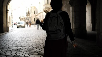 Attractive Girl With Yellow Backpack Walks Through Arch By Historical Places In Dresden