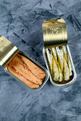 Two cans of canned sardines and mackerel in olive oil
