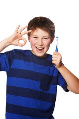 Toothbrush, portrait or child with perfect hand in studio for dental, care or feedback on white background. Teeth, cleaning or boy kid face with OK, yes or success emoji for oral hygiene or wellness