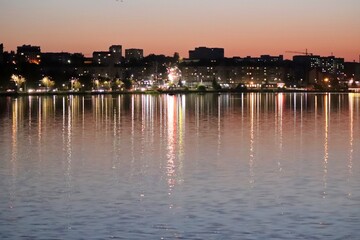 Reflection of city lights in the water of a Ternopil pond.