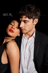 loving elegant multicultural couple spending good time together on date at cinema, Valentines day