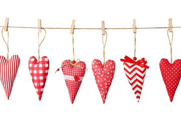 Set of fabric valentines hanging on a rope on a white background