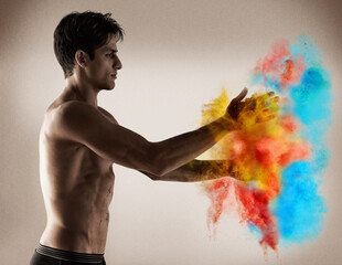Color, explosion and man with powder in hands with creativity, performance and studio. Vibrant,...