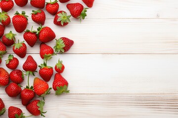 Red ripe strawberries on white wooden background