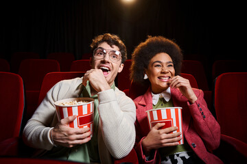 cheerful young diverse couple in retro attires with 3d glasses having great time on their date