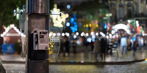 A Phone Pole on a City Street - obrazy, fototapety, plakaty