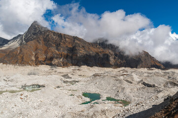 Pass through Ngozumpa glacier from Gokyo to Dzongla in mountains of the Himalayas during EBC Everest bace camp or Three passes trekking in Sagarmatha, Khumjung, Nepal.