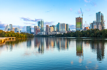 Fototapeta na wymiar skyline of Austin in early morning light with mirroring city in the colorado river, Texas