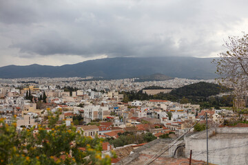 Fototapeta na wymiar Greece Athens city view from the Acropolis on a cloudy summer day