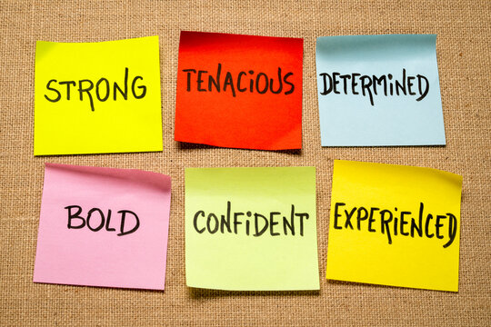 inspirational power words - strong, tenacious, determined, bold, confident and experienced - set of sticky reminder notes against burlap canvas